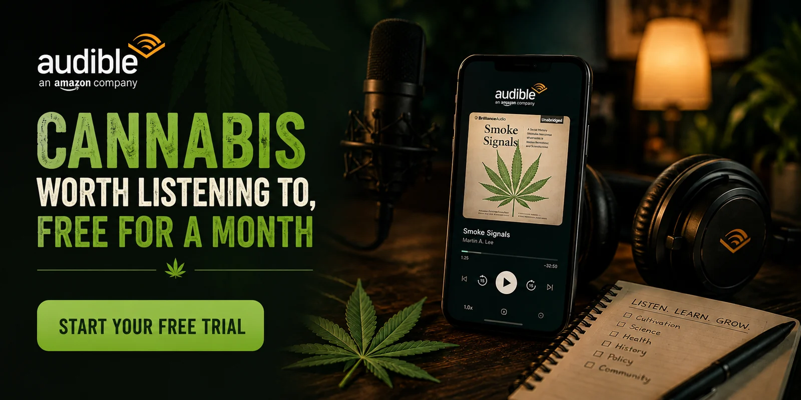 Audible promotion: a phone on a dark table playing the Smoke Signals audiobook, beside a studio microphone, headphones and a notepad, under the headline Cannabis worth listening to, free for a month